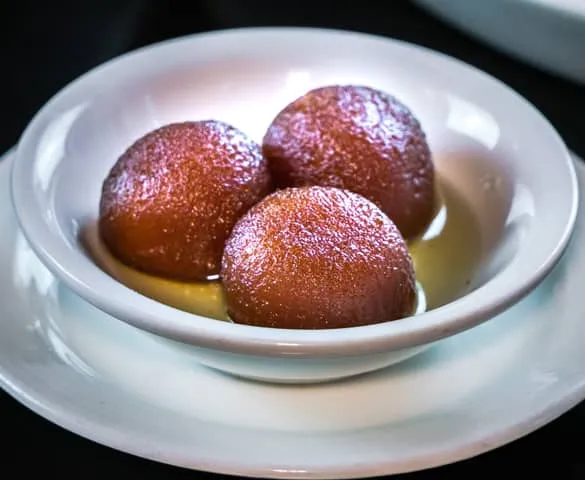 Gulab jamun dessert at Flames & Grills By Tuli's in Calgary, AB